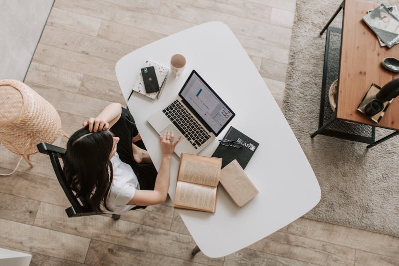 Illustration 1: Woman using a laptop at a clean desk